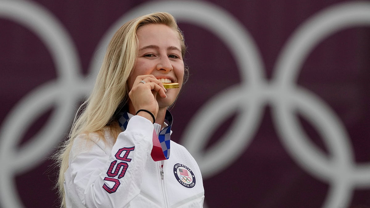 FILE - Nelly Korda, of the United States, bites her gold medal of the women's golf event at the 2020 Summer Olympics, Saturday, Aug. 7, 2021, at the Kasumigaseki Country Club in Kawagoe, Japan. Korda will be a strong favorite to win another gold at the Paris Games.

 -  (AP Photo/Andy Wong, File)